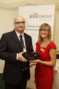 Ian Cross and Laura Smith from Sage UK collecting the award.