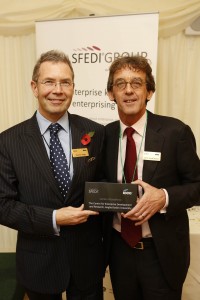 Professor Lester-Lloyd Reason (right) receiving the award for CEDAR from Stephen Pegge of Lloyds Banking Group.